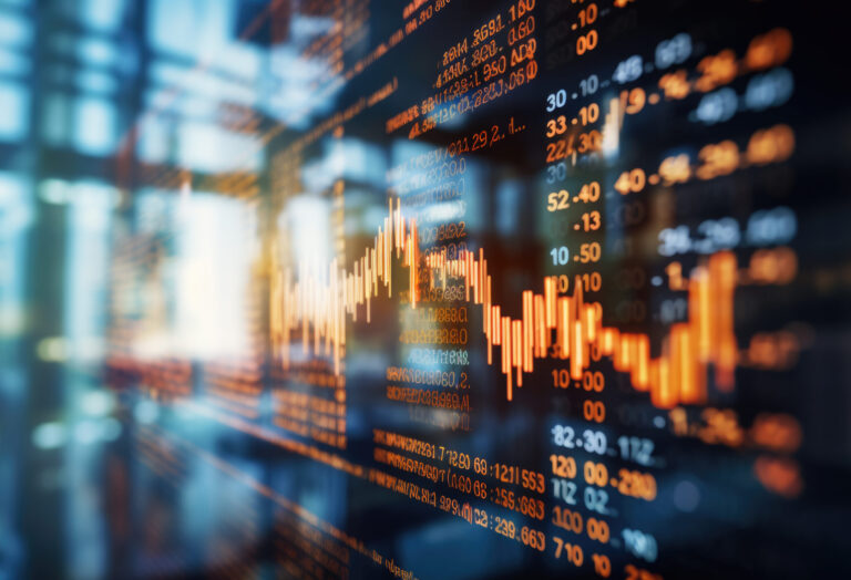 Close-up of a digital screen displaying financial stock market data with graphs and analytics, illustrating market trends and investment analysis.