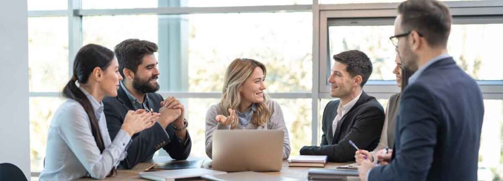 A positive team meeting representing aligned HR and internal teams