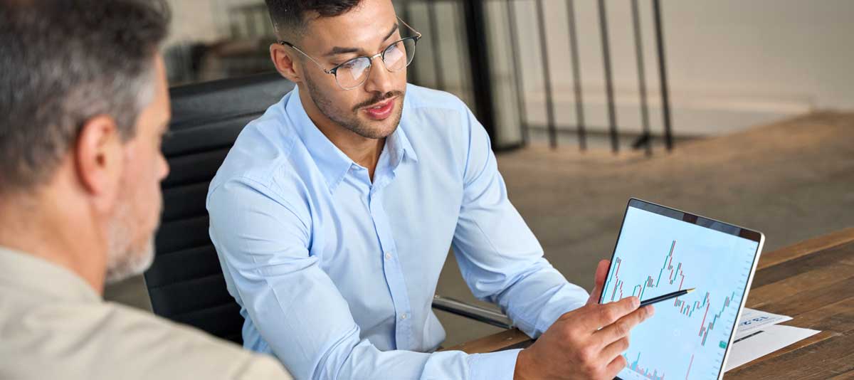 man showing job growth on a screen.